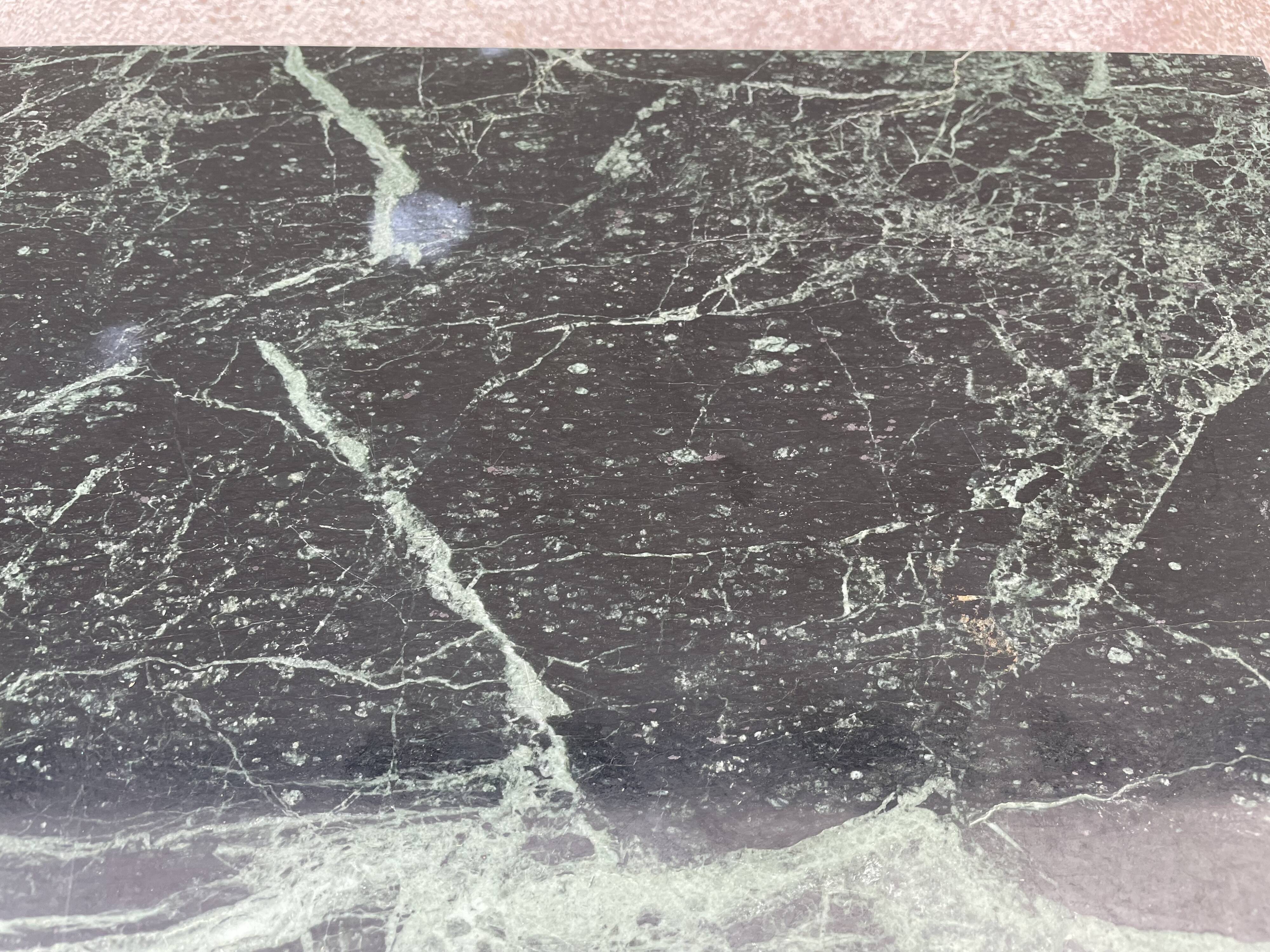 Coffee table in gilded brass and veined green marble