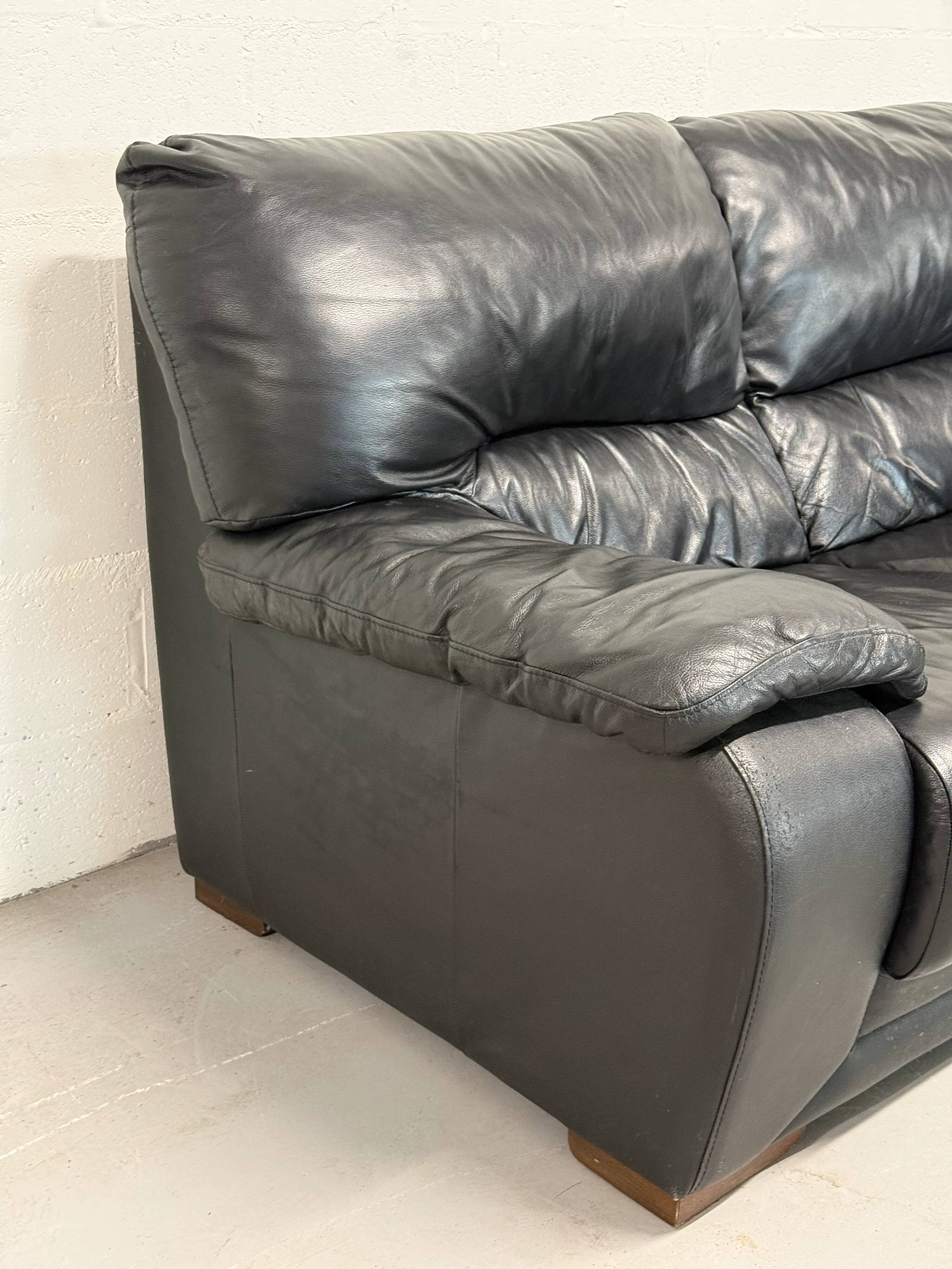 Two-seater black leather sofa — Italian postmodern design