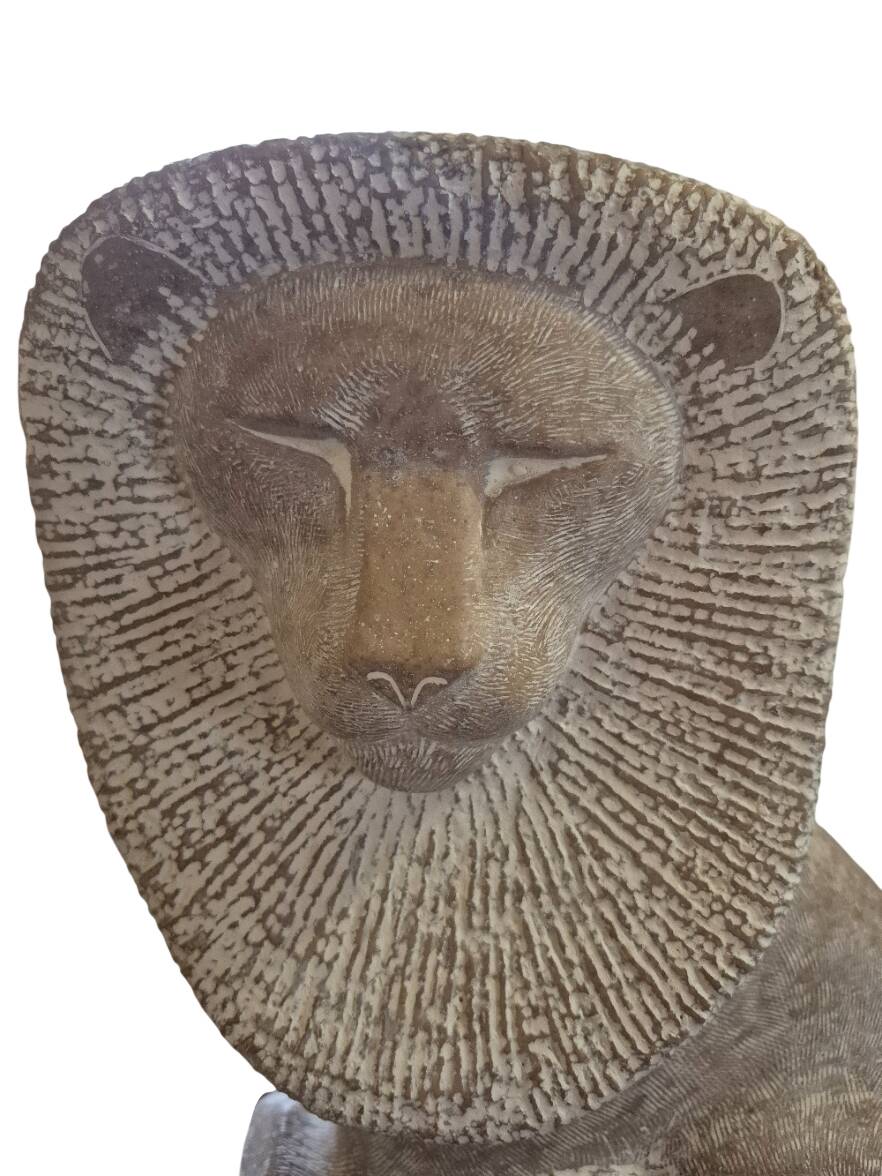 Sculpture of a lion in stone by Islay Grimes.