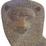 Sculpture of a lion in stone by Islay Grimes.