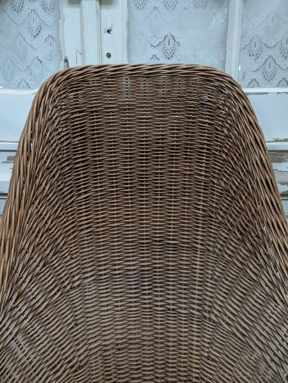 Large woven rattan armchair