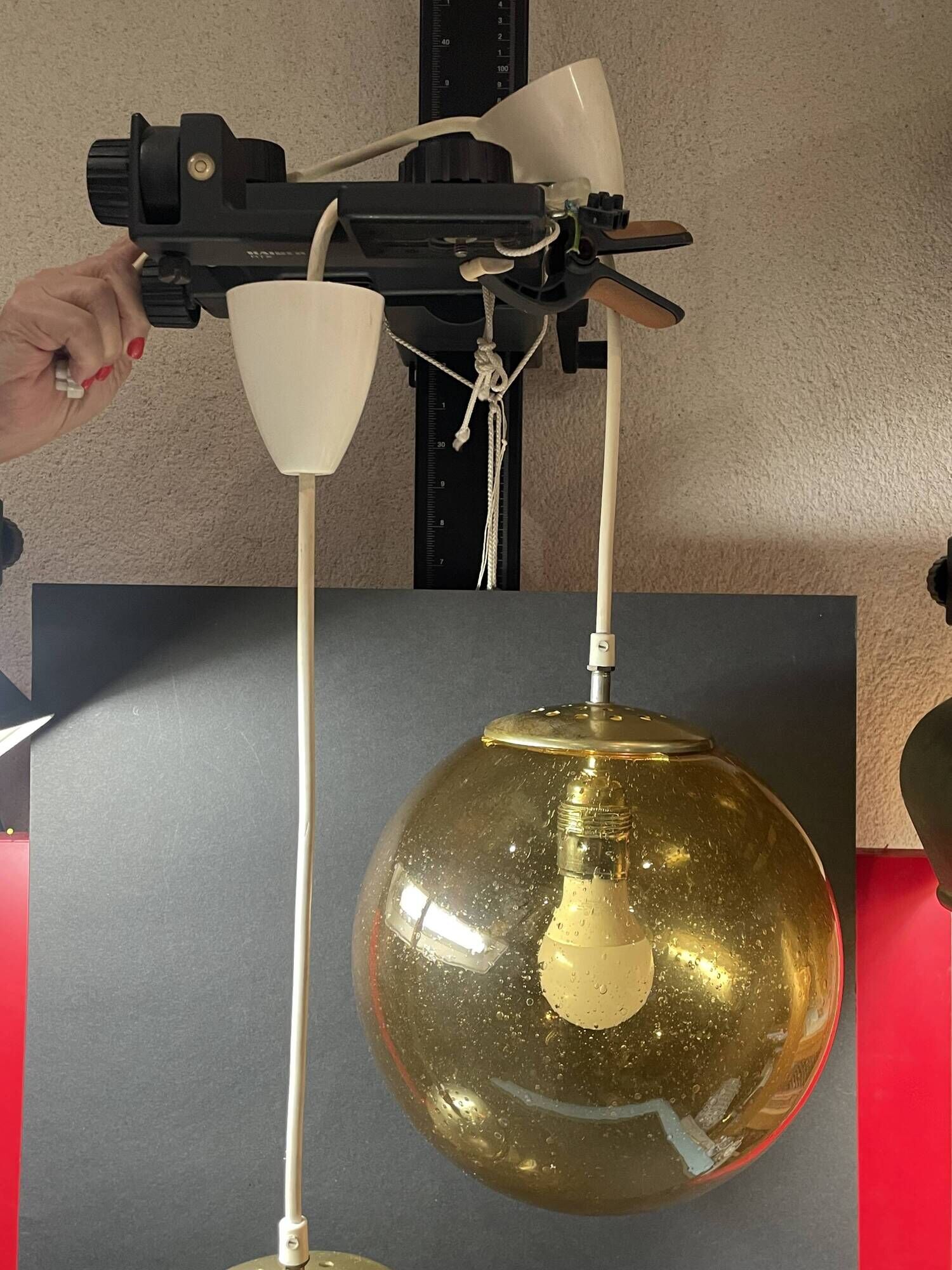 Pair of vintage smoked glass ball pendant lights from Biot glassworks