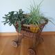 Wicker rattan doll cradle with wheels