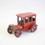 Vintage tin car with pull lever