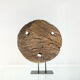 Old decorative wooden wheel on foot