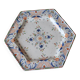 Ancient hexagonal plate in earthenware with polychrome floral decoration.