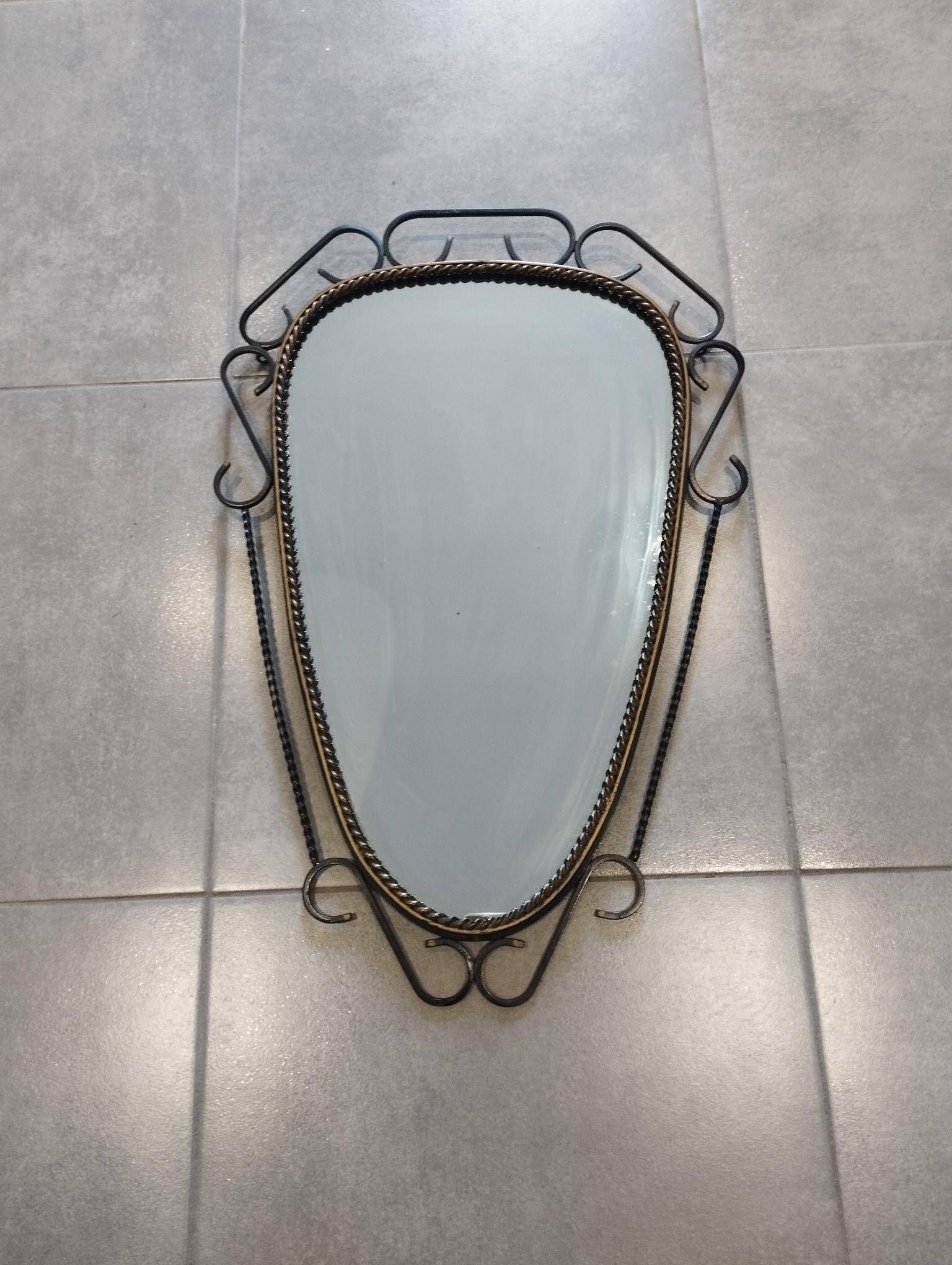 Mid-century modern iron mirror, brutalist, vintage organic, thick sixties.