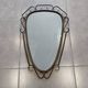 Mid-century modern iron mirror, brutalist, vintage organic, thick sixties.