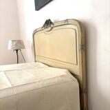 Carved and painted wooden bed