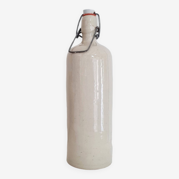 Old cream-colored stoneware bottle