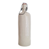 Old cream-colored stoneware bottle