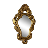 Golden mirror in baroque style.