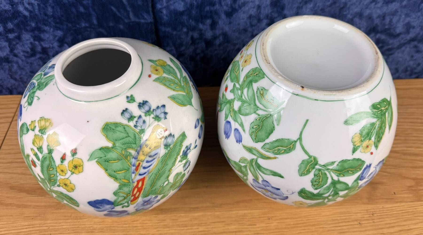China circa 1900: pair of porcelain ball vases with birds and flowers