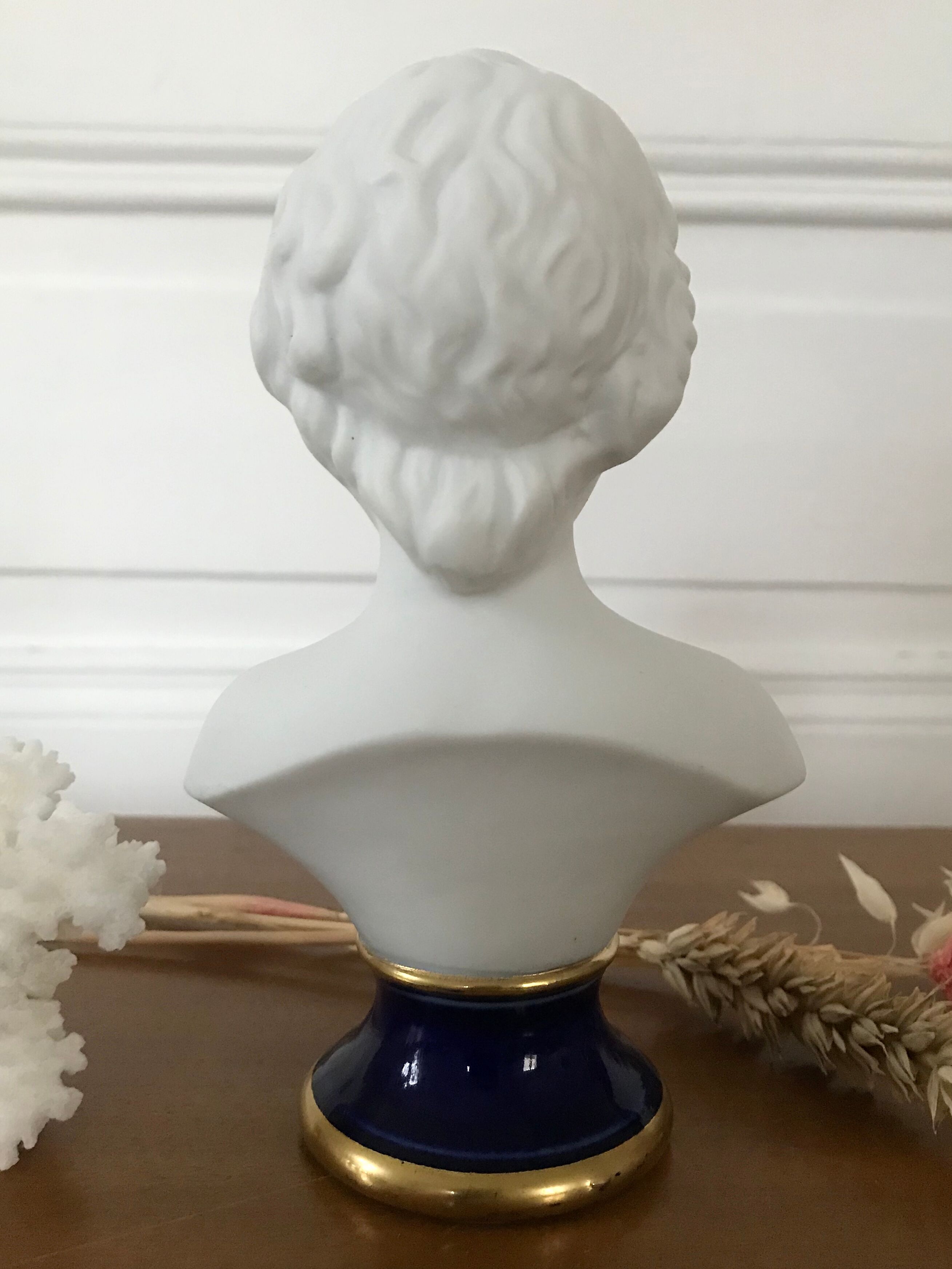 Ancient statuette bust in biscuit