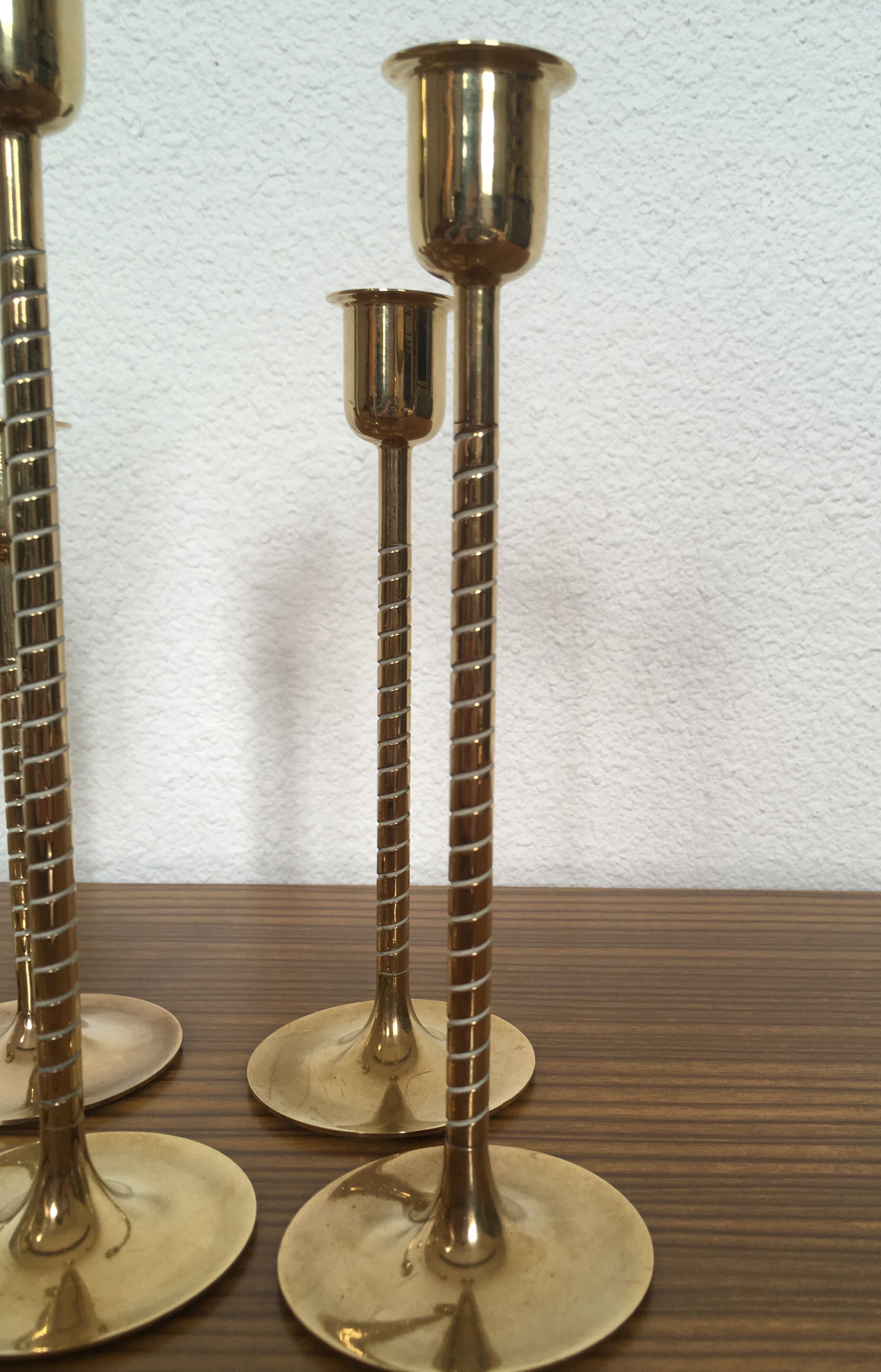 Series of 7 Scandinavian brass candlesticks