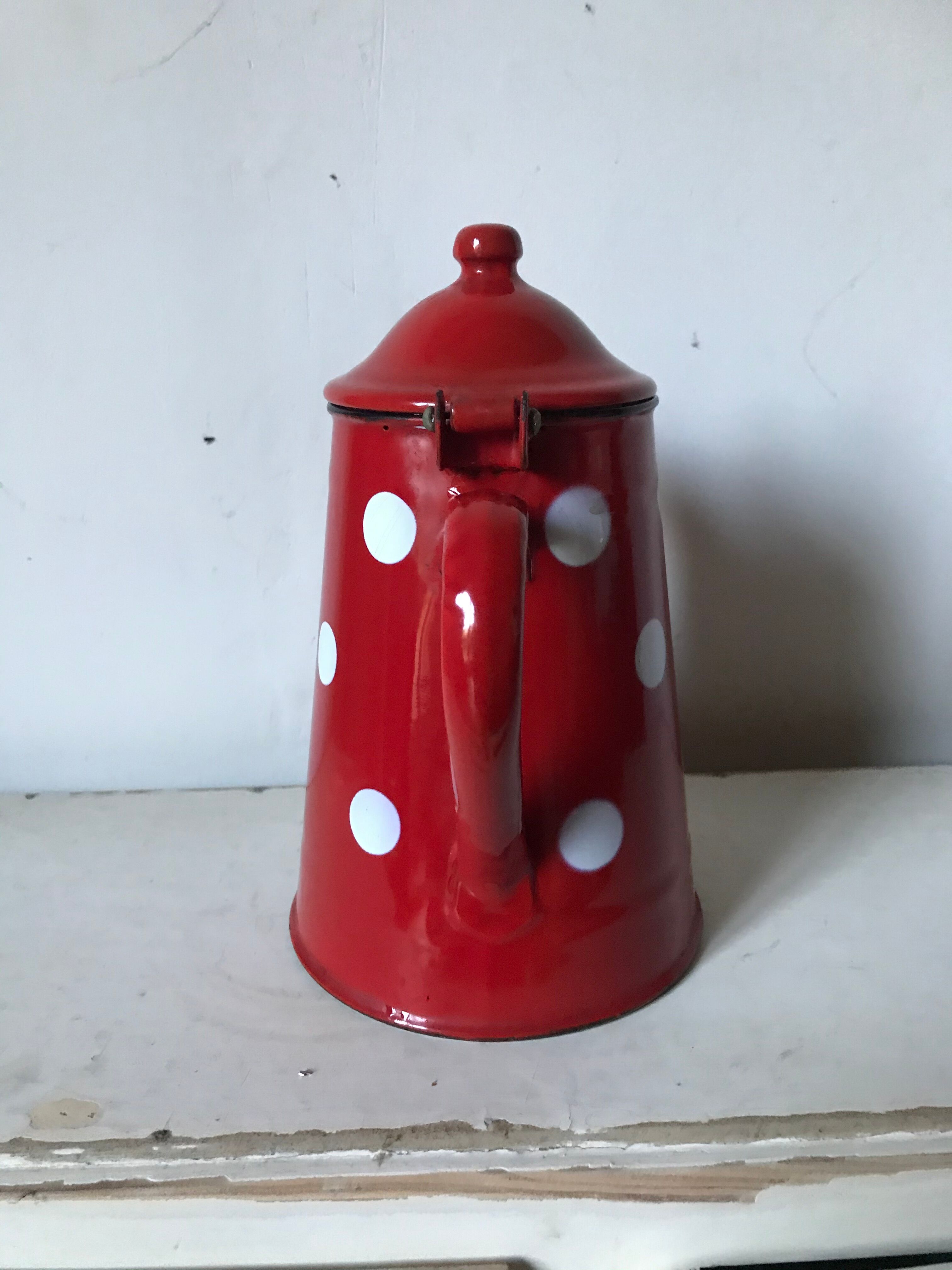 Red enamelled coffee maker with white polka dots
