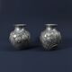 Pair of Art Deco vases in aluminium Signed