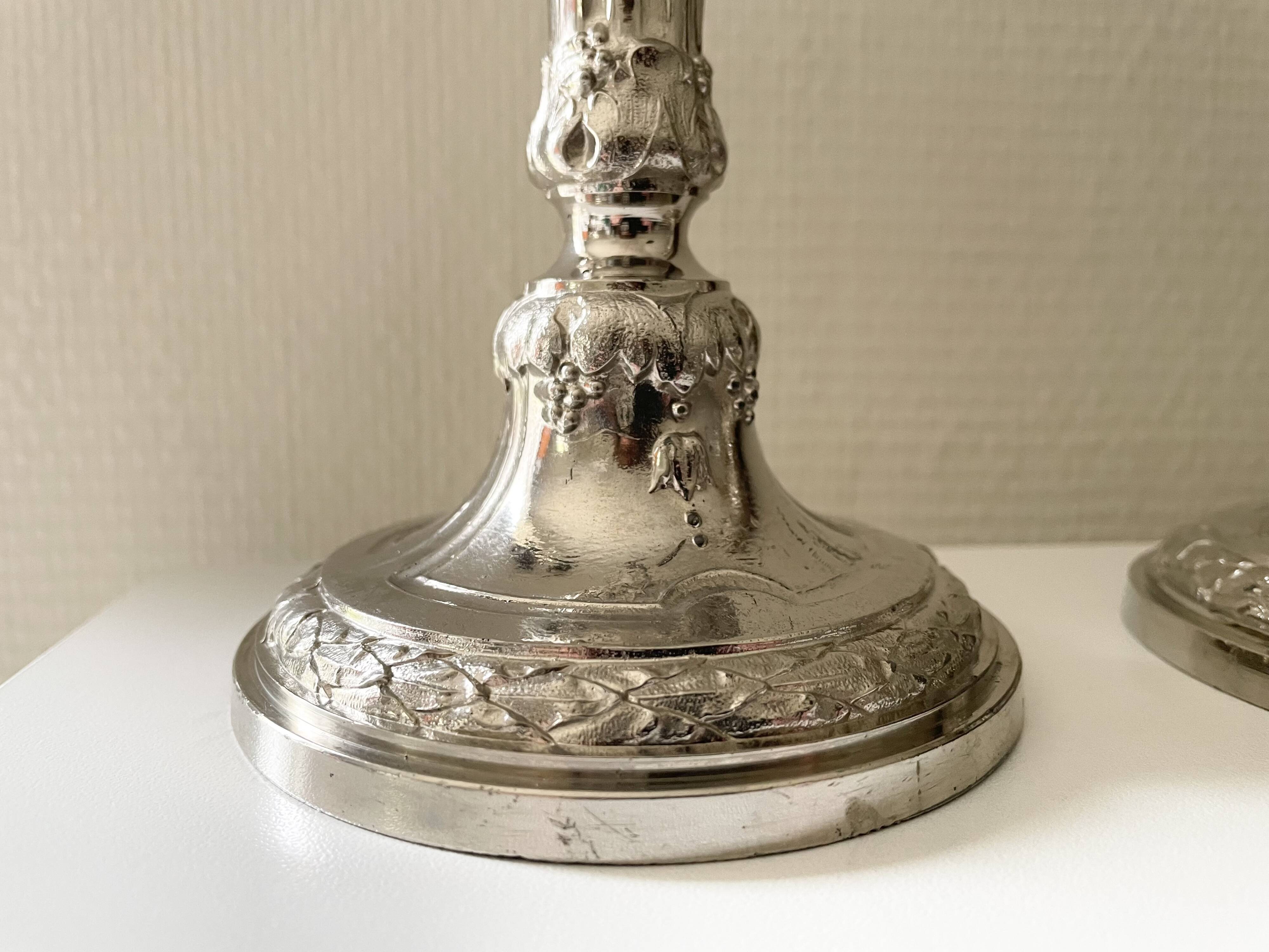 Antique silver-plated candlesticks in classic style