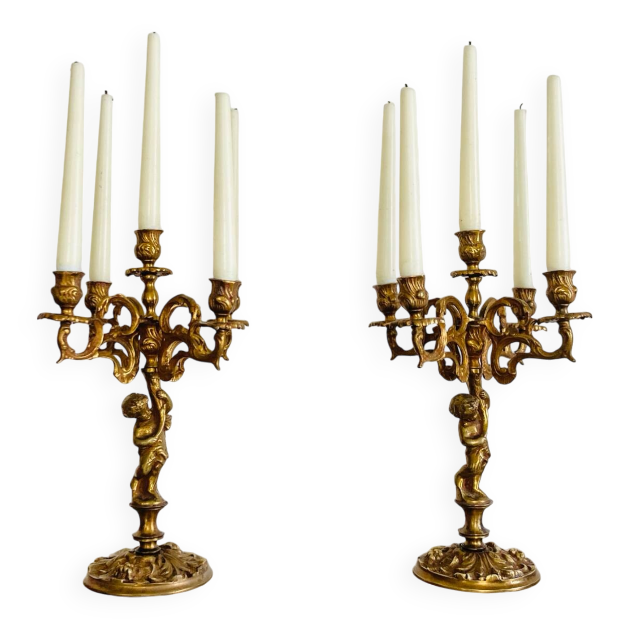 Solid bronze candlesticks decorated with putti, acanthus leaves and lion heads