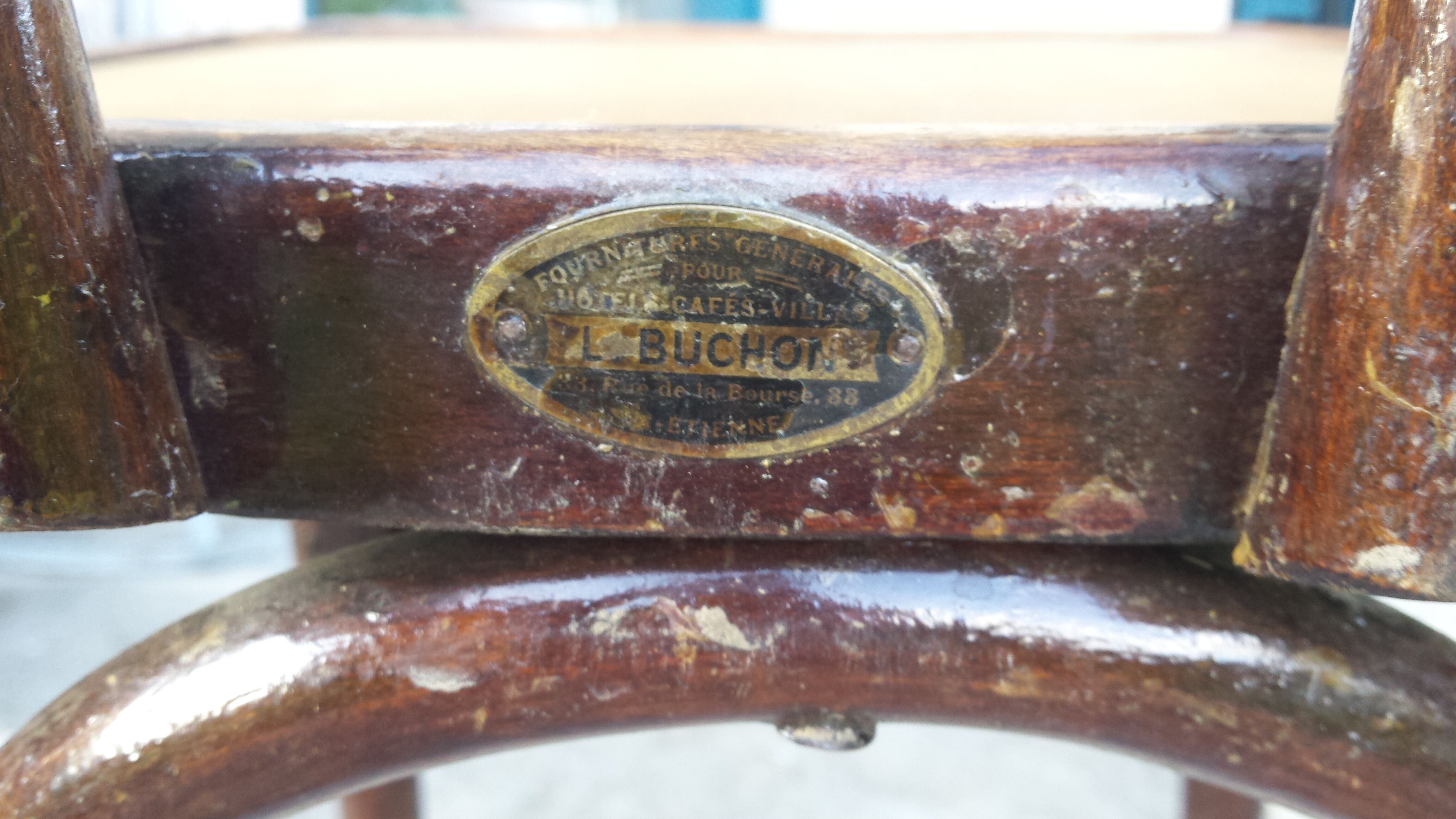 Bistro chair with buchon brand plate