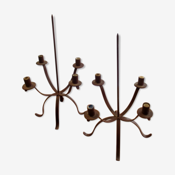 Pair of candle holders, in painted iron