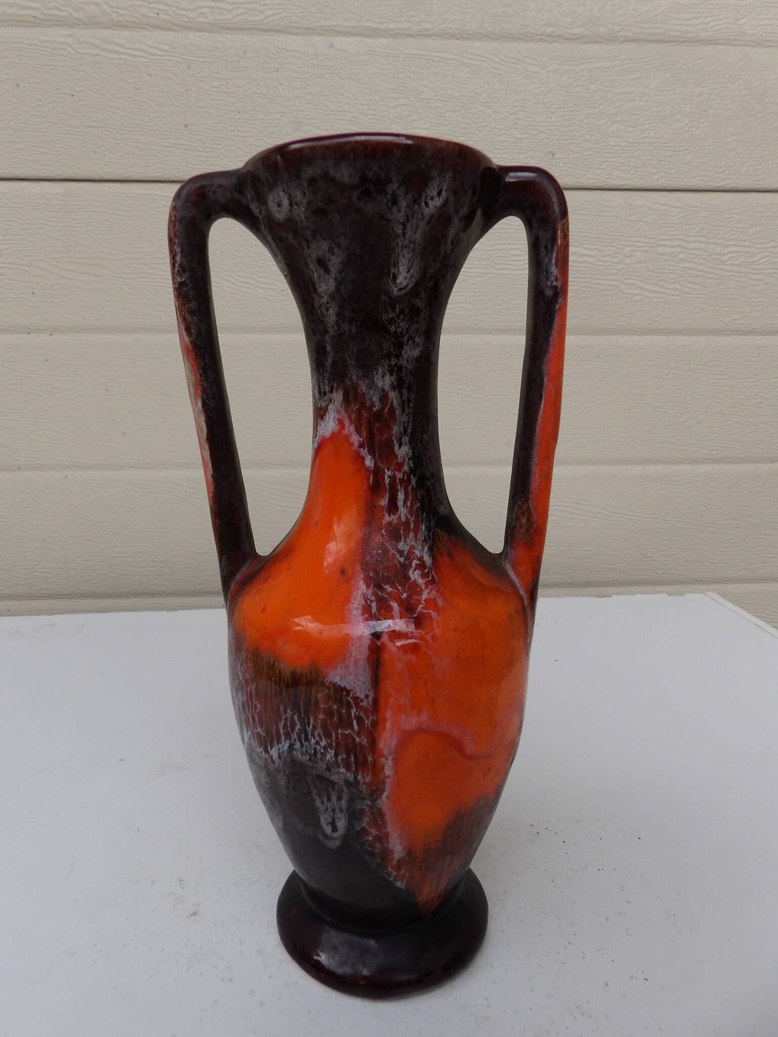 Vase with two orange handles