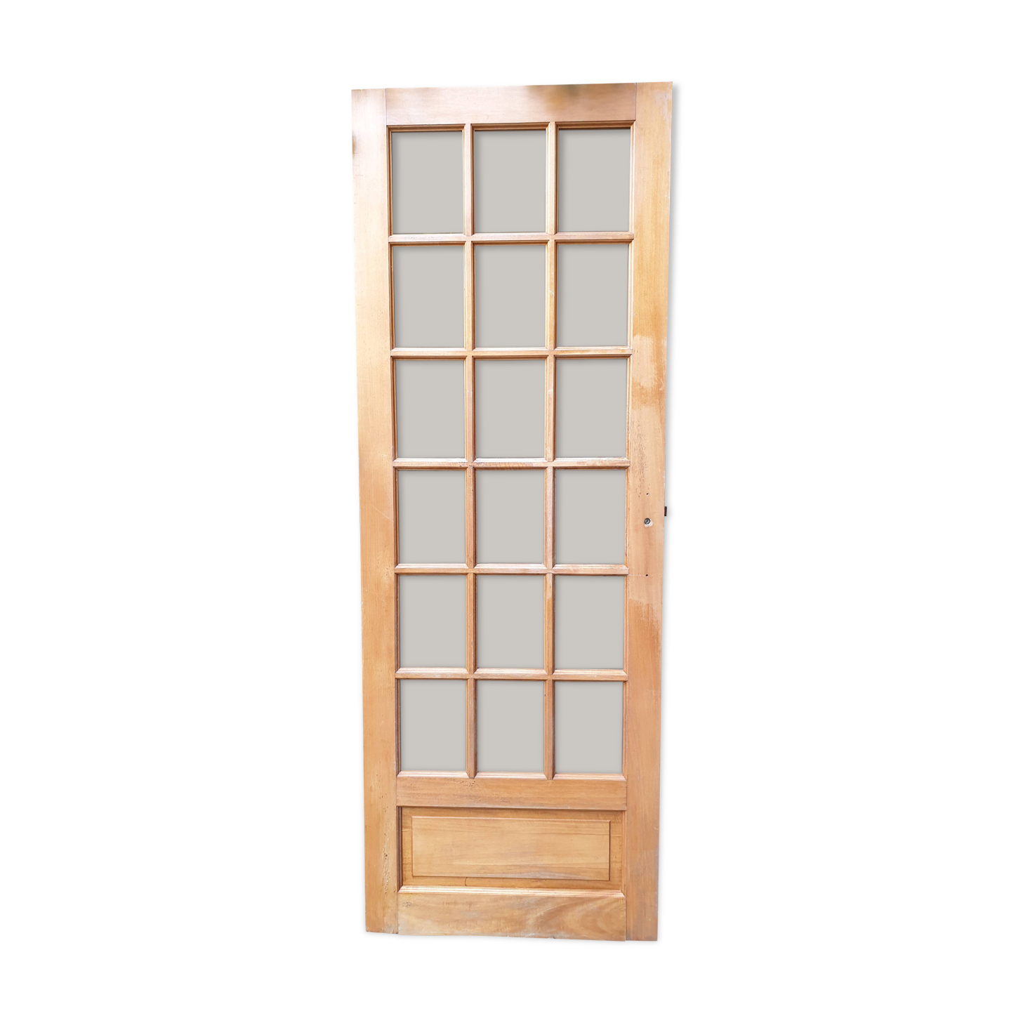 Old wooden door glazed with small tiles