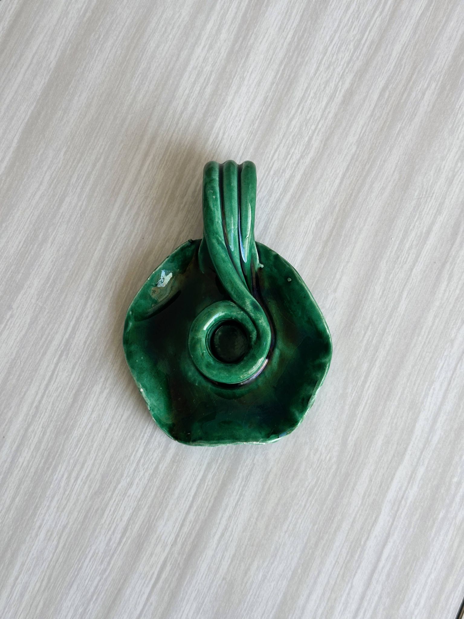 Vintage green glazed ceramic candle holder, organic design.