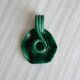 Vintage green glazed ceramic candle holder, organic design.