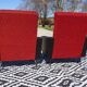Vintage armchairs in red and black faux leather, the pair.