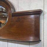English mahogany shelf with its bevelled mirror from the early 20th century.