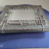 Tin mirror on brutalist wood support