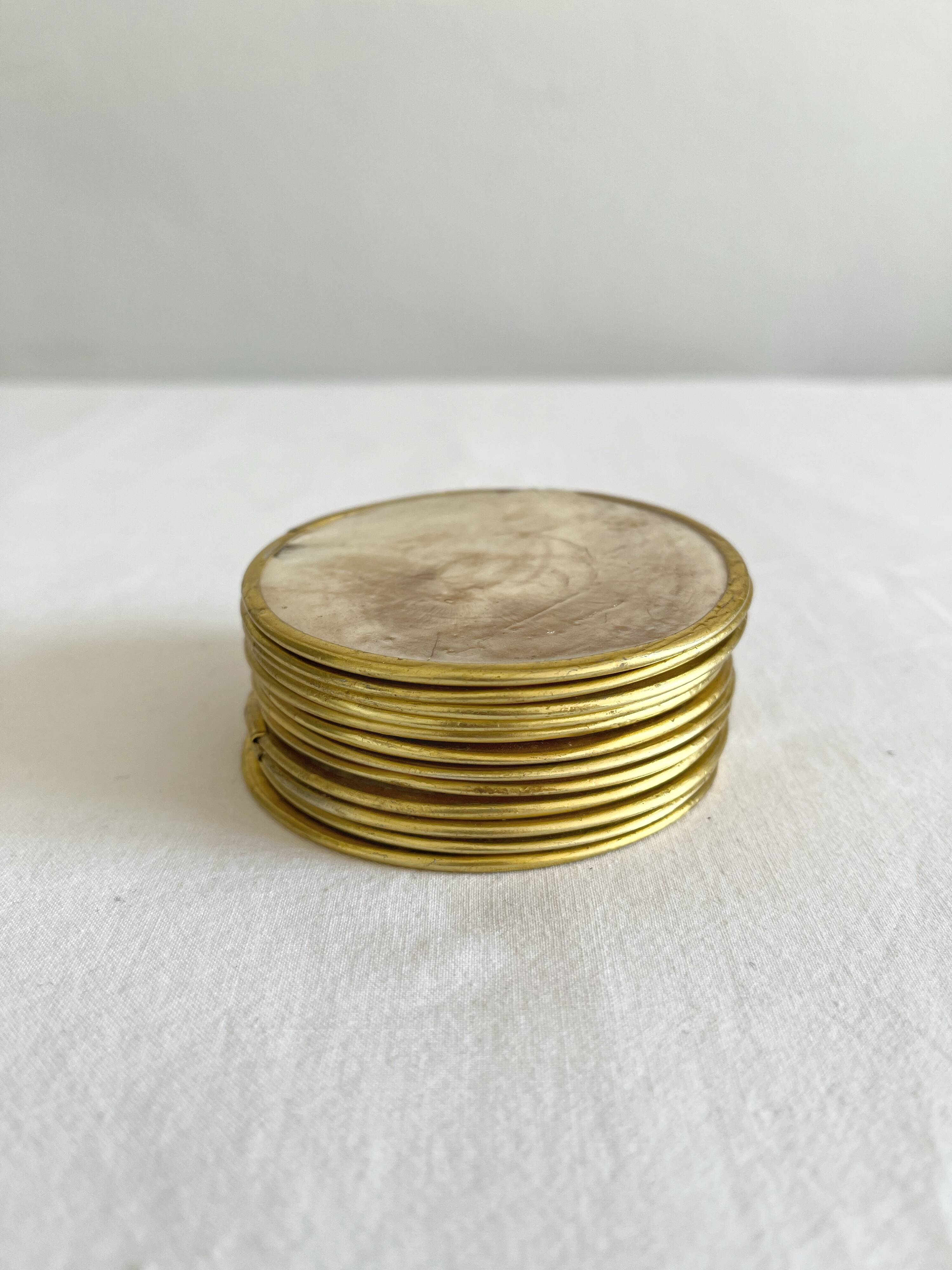 12 coasters in mother-of-pearl and vintage brass