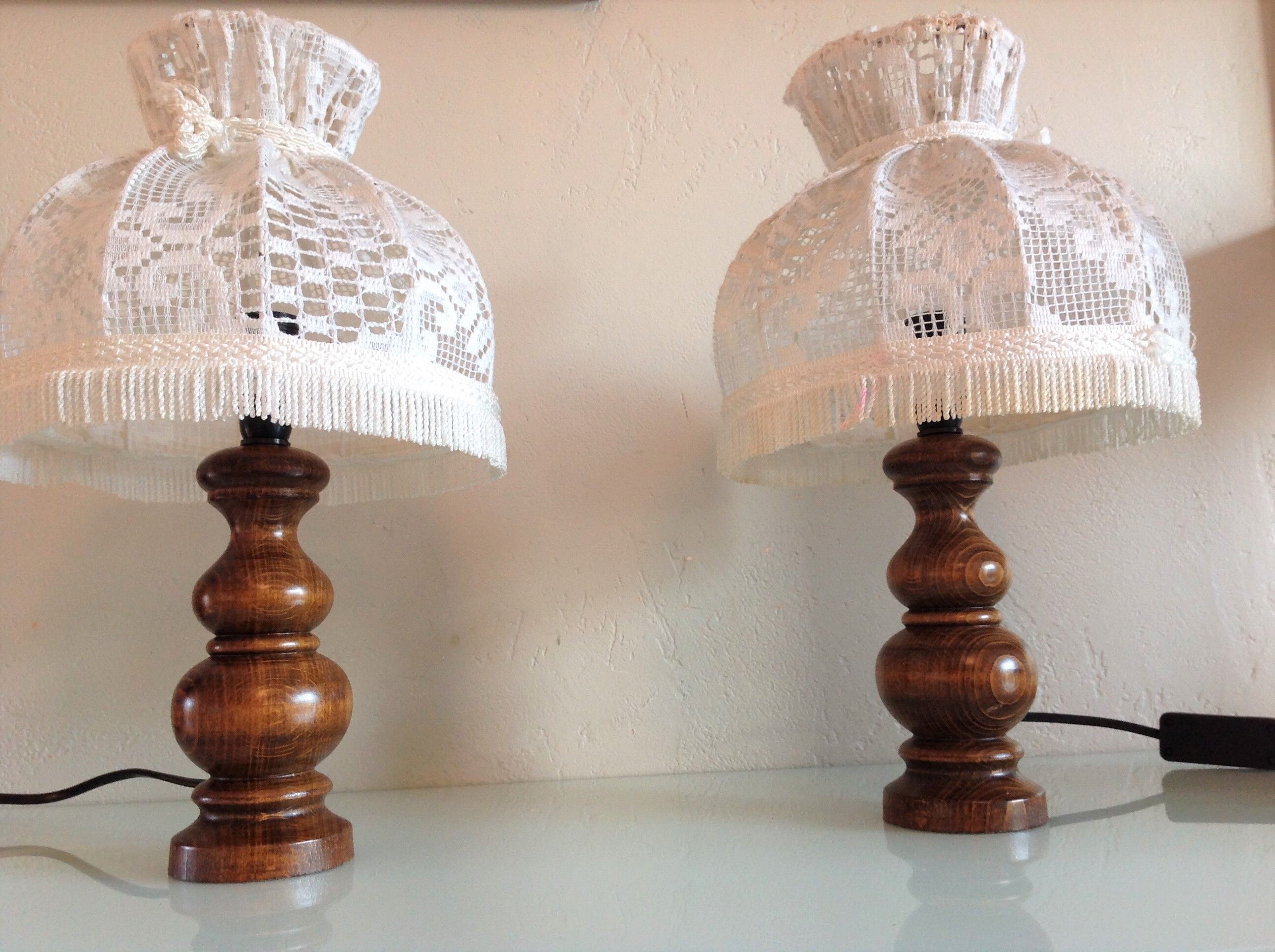 Pair of turned wooden bedside lamps and lace/vintage lampshade 60s-70s