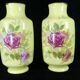 Pair of Limoges porcelain vases decorated with rose bushes
