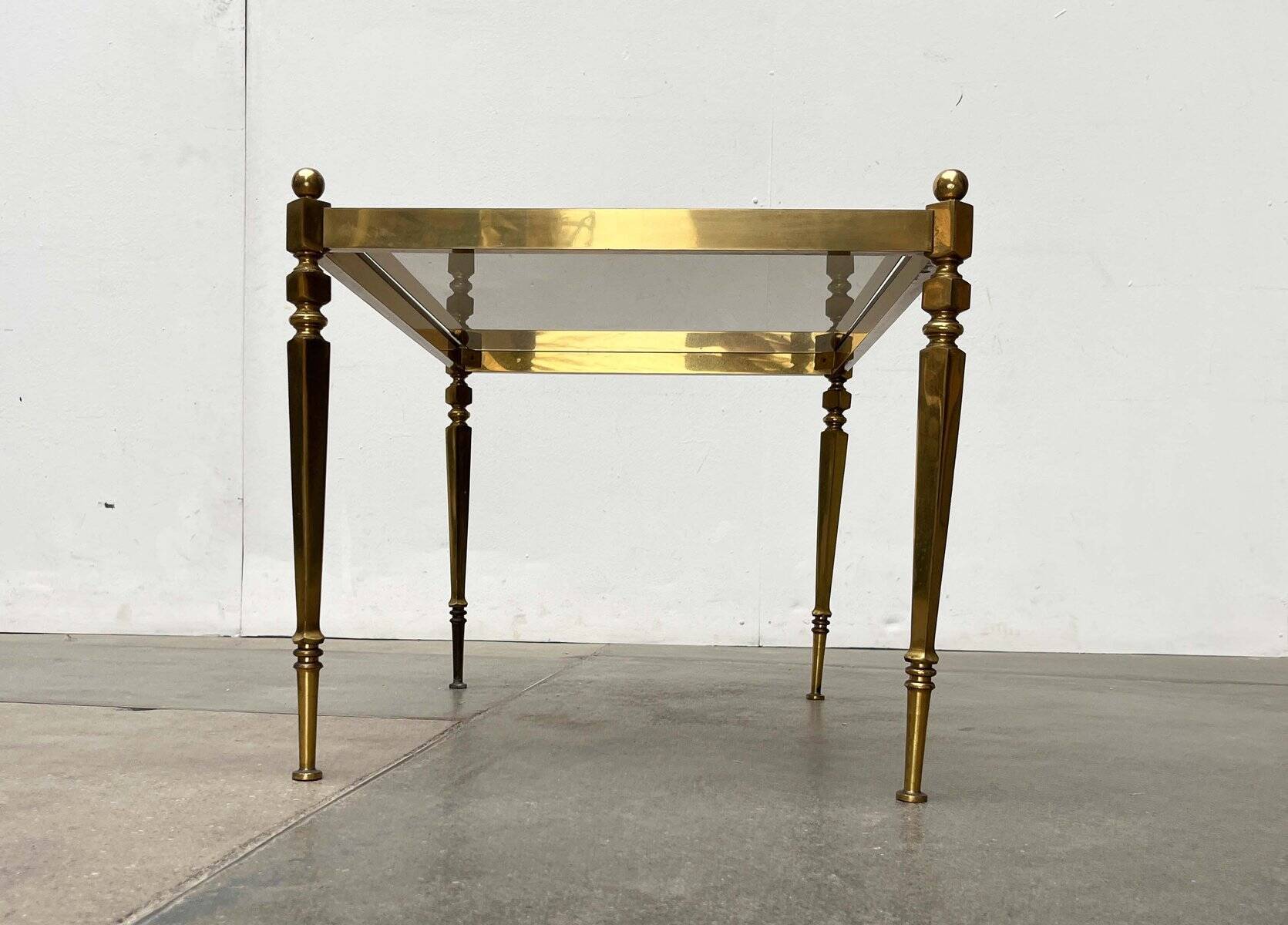 Mid-century German Hollywood neoclassical brass and glass side table from the 1950s.