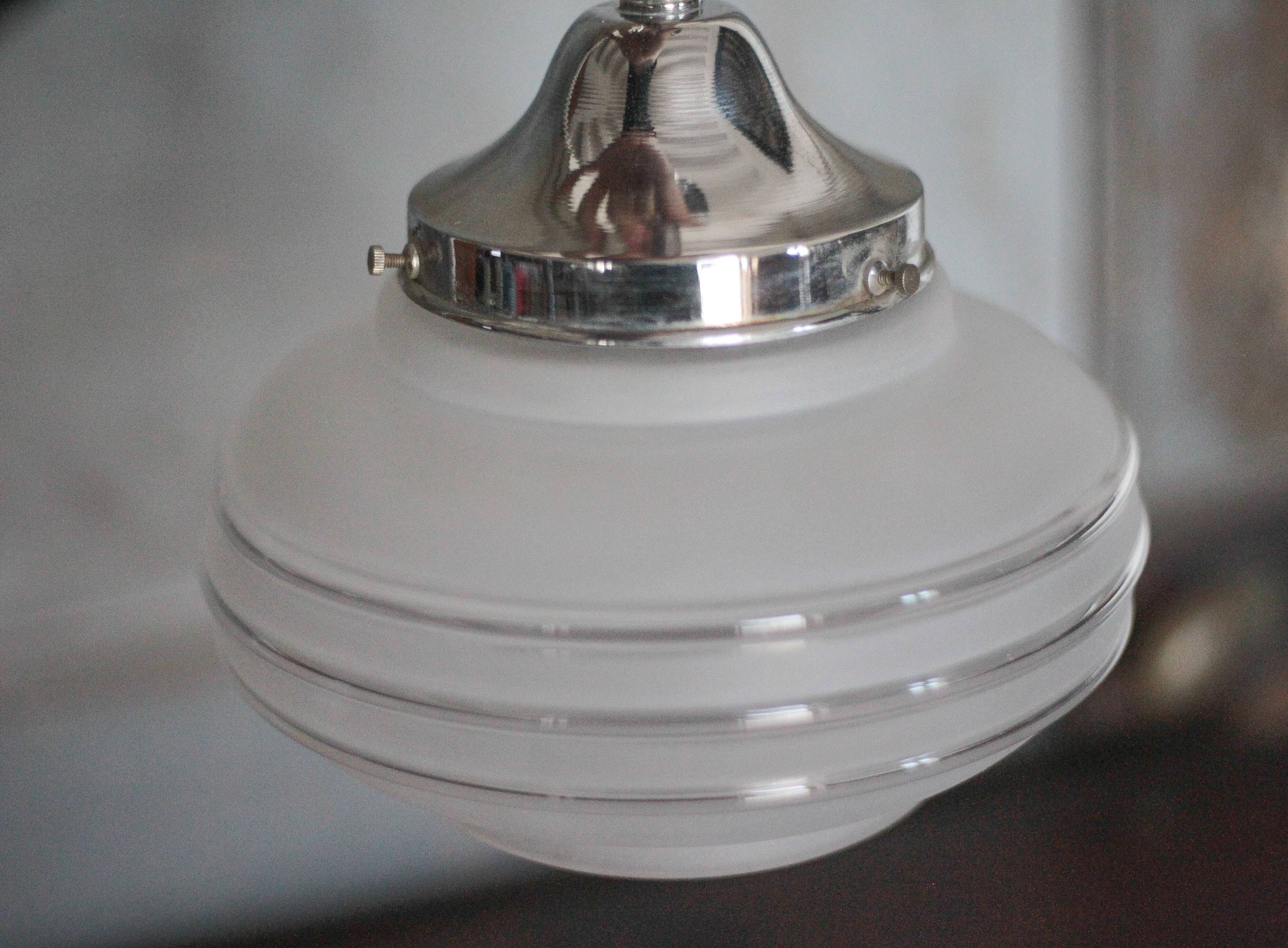 Art Deco pendant light, chrome metal suspension and glass globe, ceiling lamp.