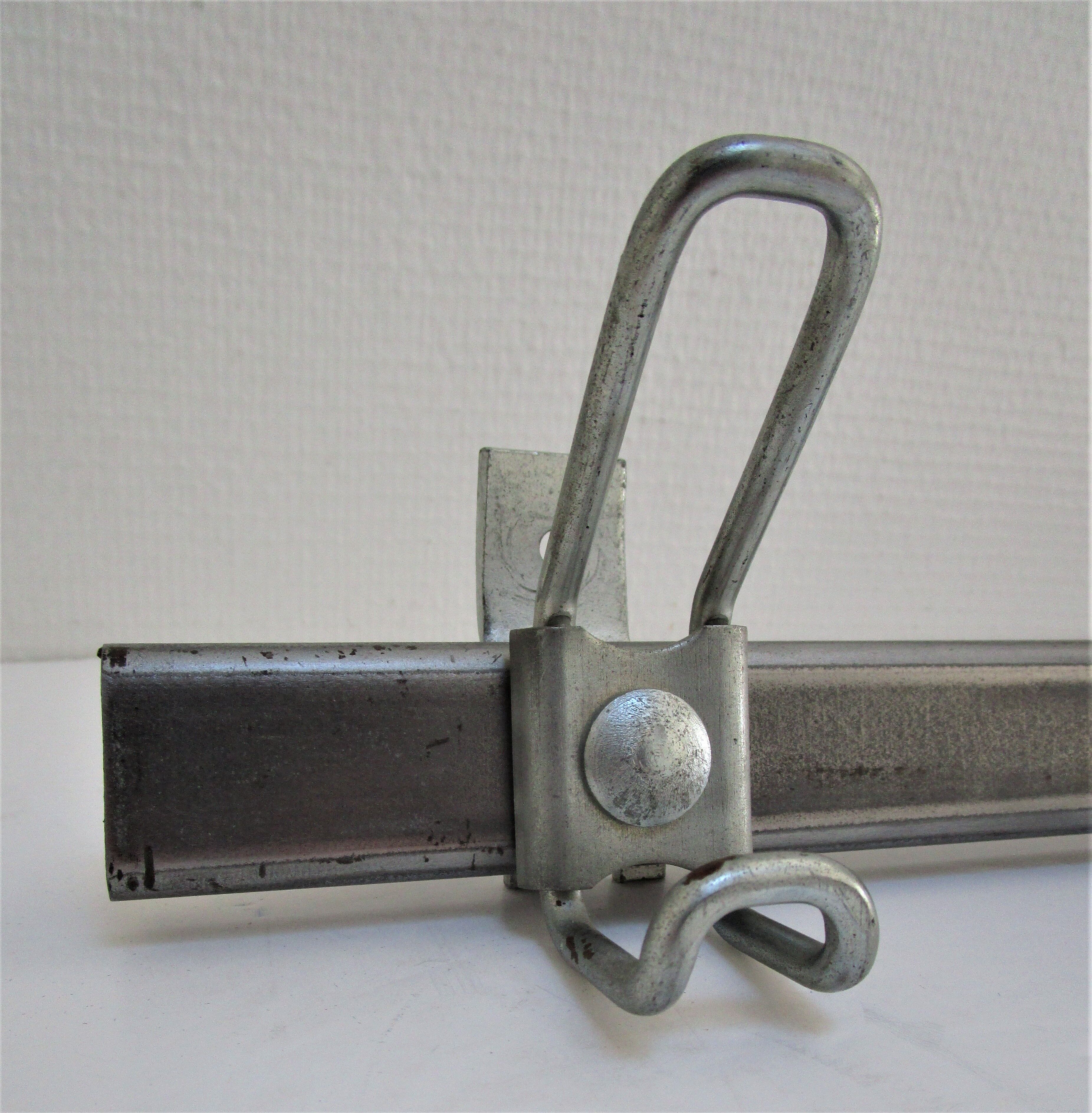Vintage school wall rack in patinated steel