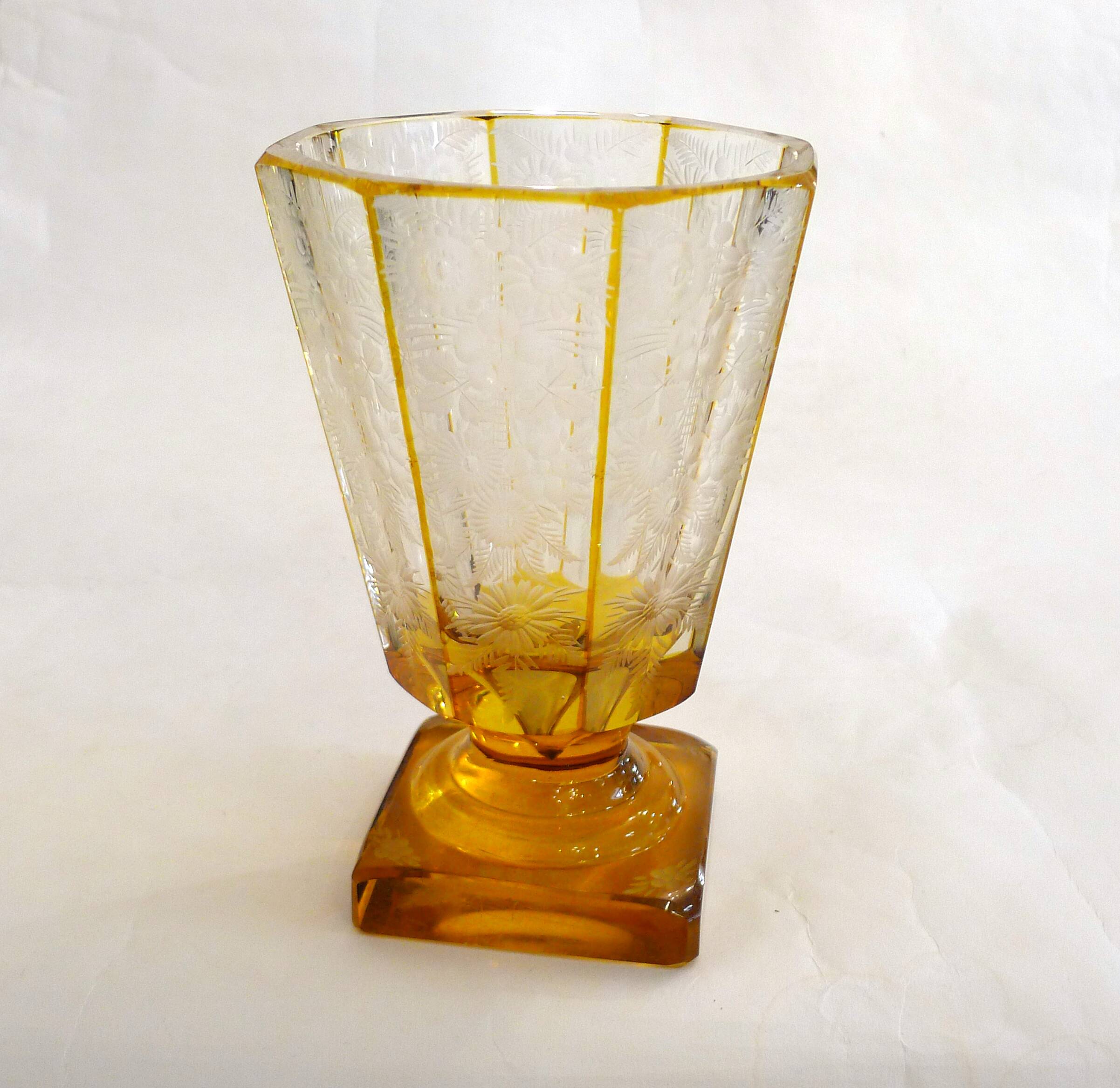 Art Deco vase engraved with flowers, faceted body on a pedestal.