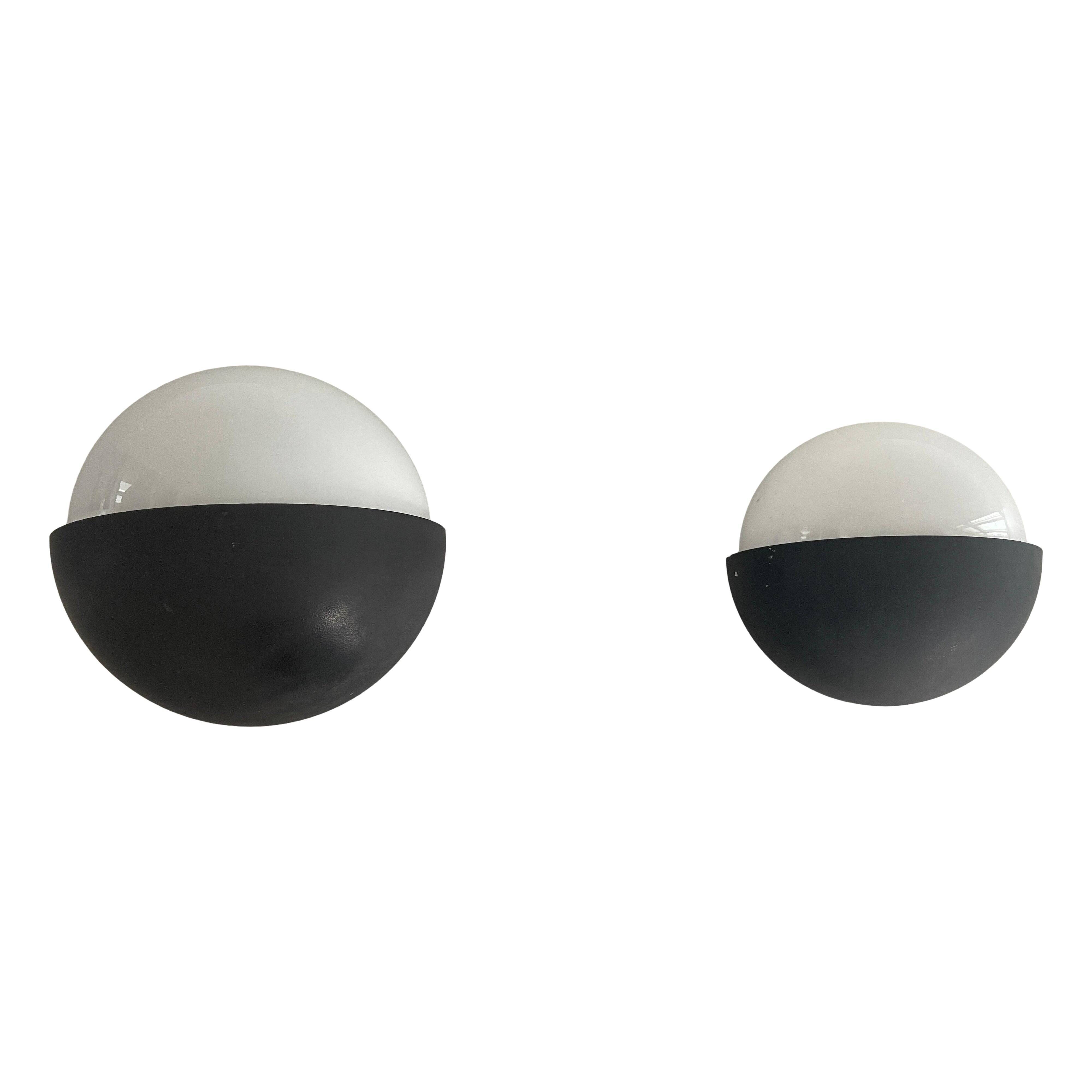 Round black metal wall lights, small and large set, by Bega, 1970s, Germany.