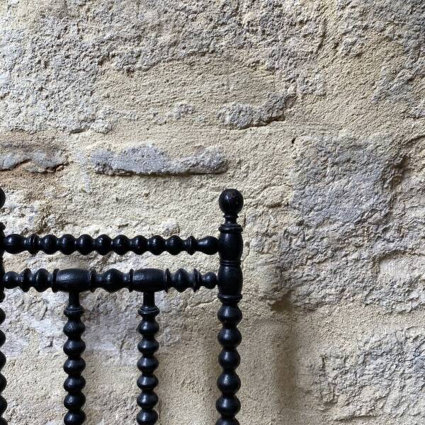 Low chair in turned wood