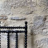 Low chair in turned wood