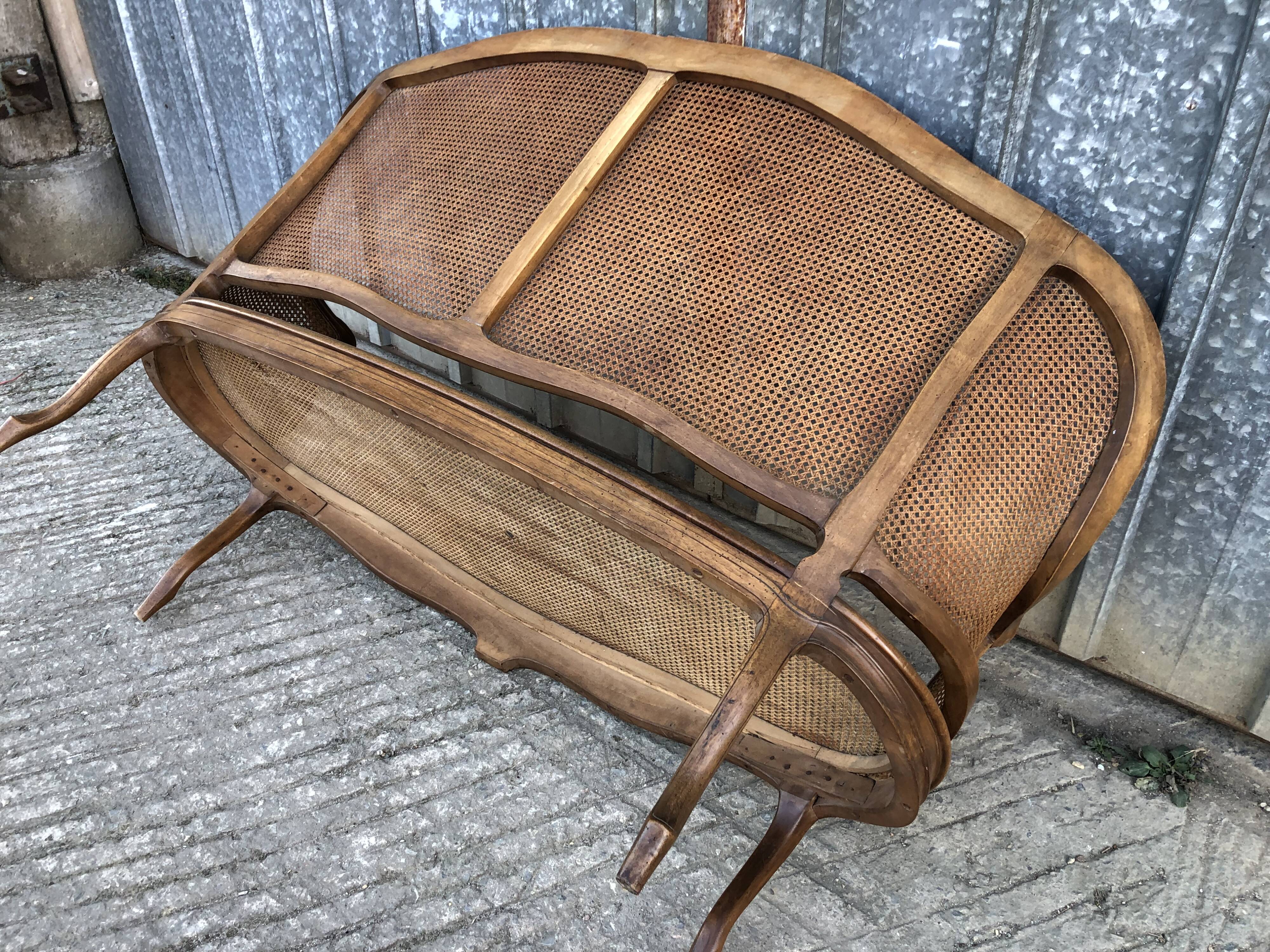 Antique Louis XV bench in solid walnut and caning