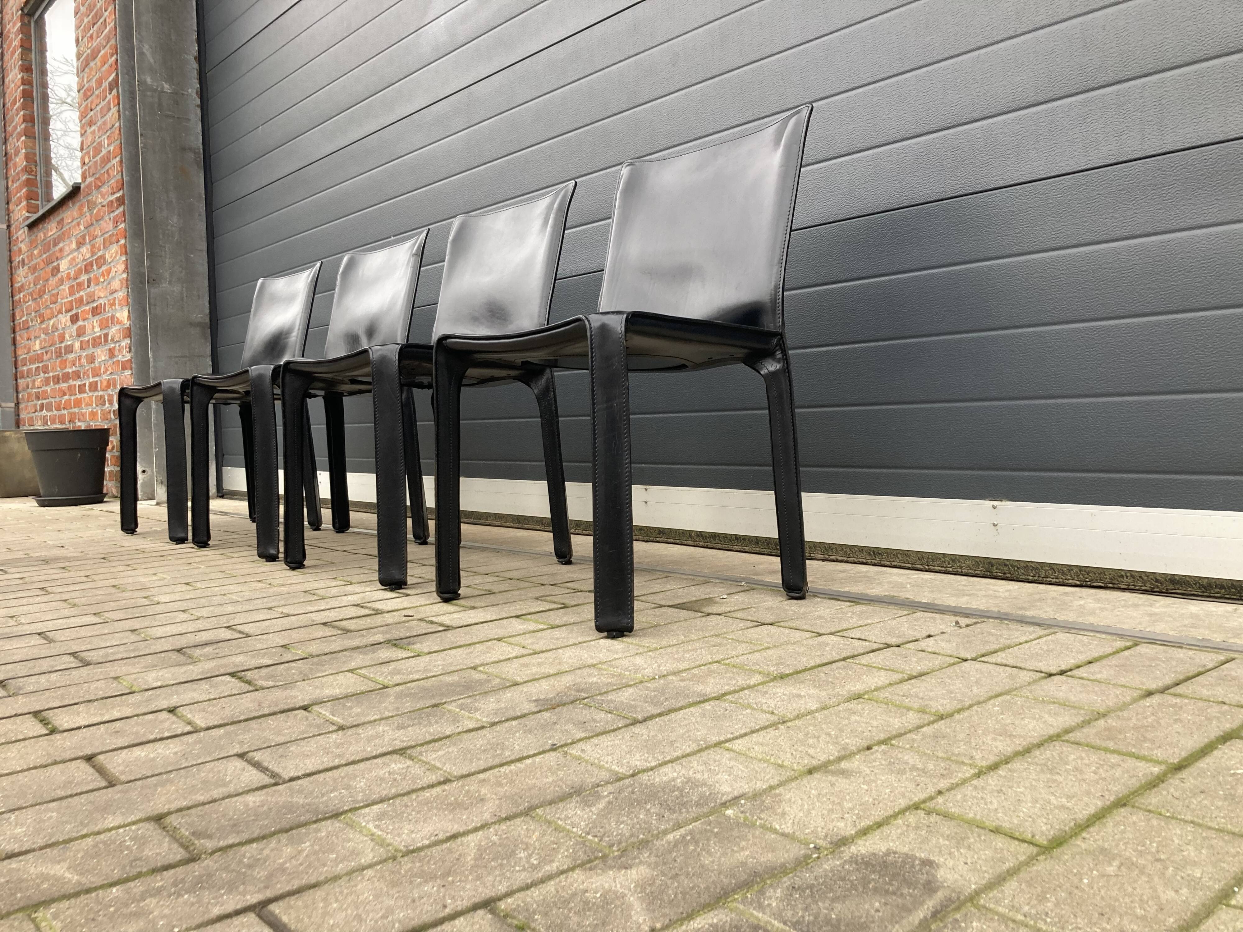 4 black Cassina Cab chairs by Mario Bellini