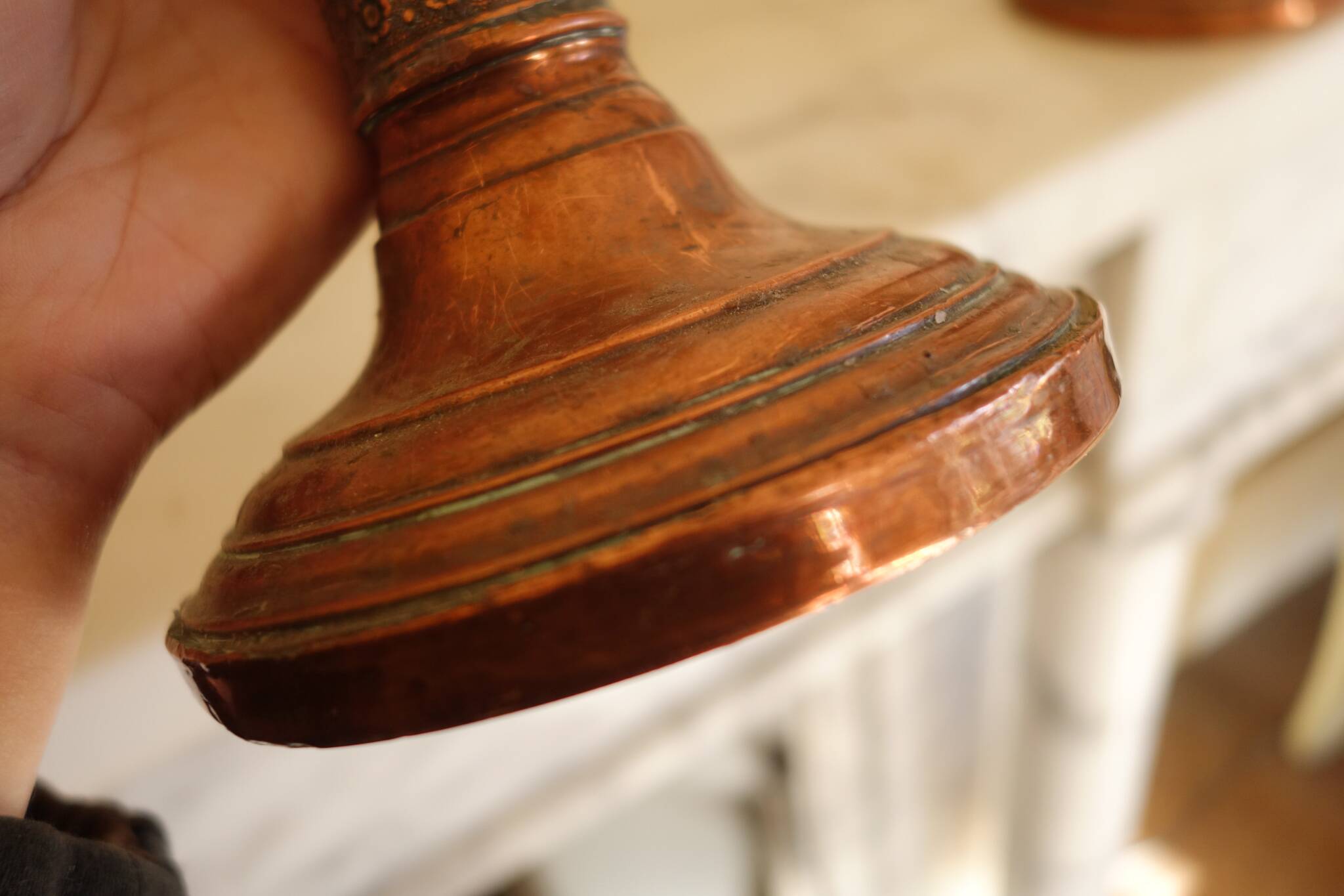 Pair of antique copper candlesticks