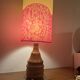 Vintage lamp with a carved wooden base from the 1970s.