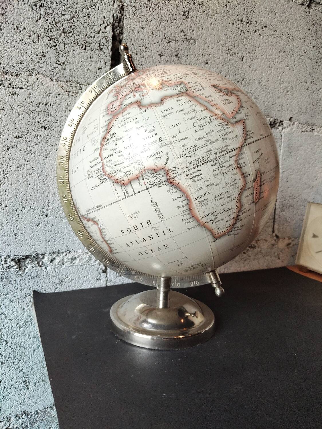 Decorative terrestrial globe on silver metal stand – explorer style