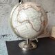 Decorative terrestrial globe on silver metal stand – explorer style