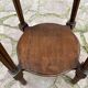 Old wooden pedestal table with marble top