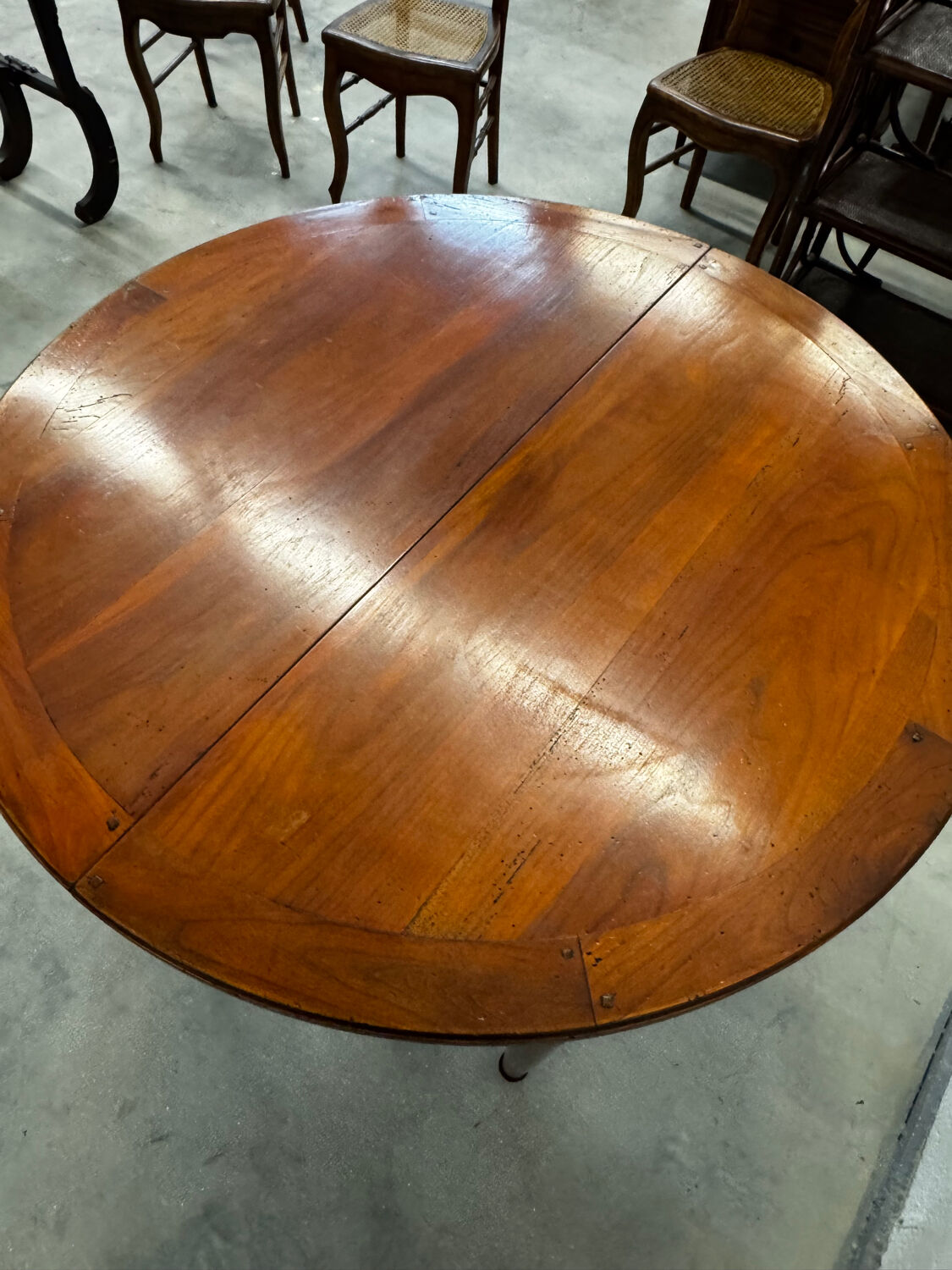 Round cherry wood table in Louis XVI style